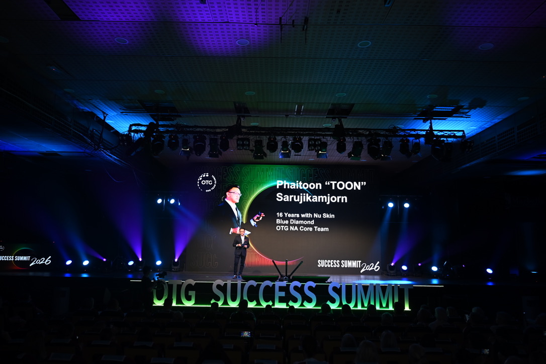 TOON speaking on the OTG Success Summit 2026 stage before a large audience