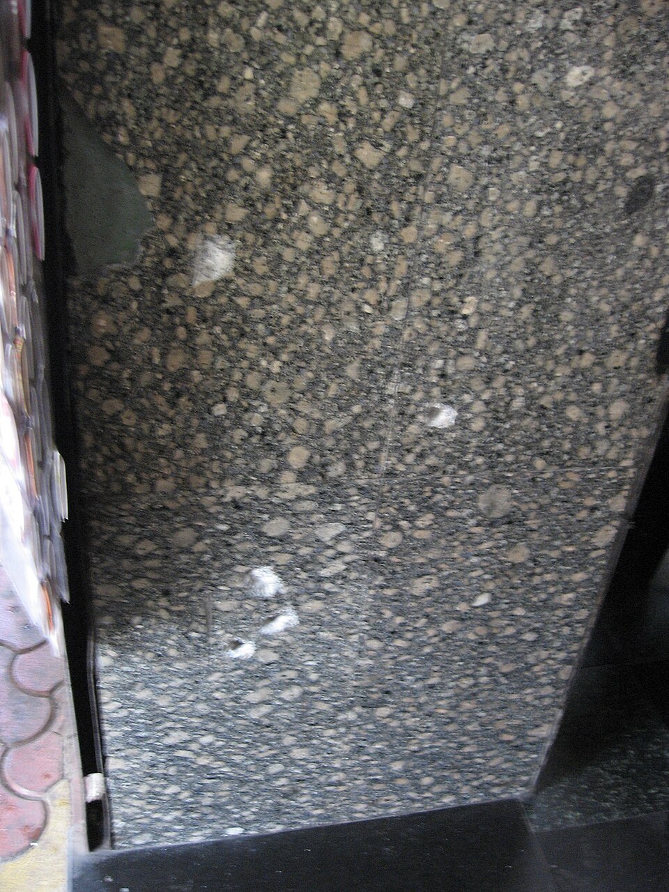 Bullet marks on a wall at Leopold Café in December 2008, Mumbai, India.