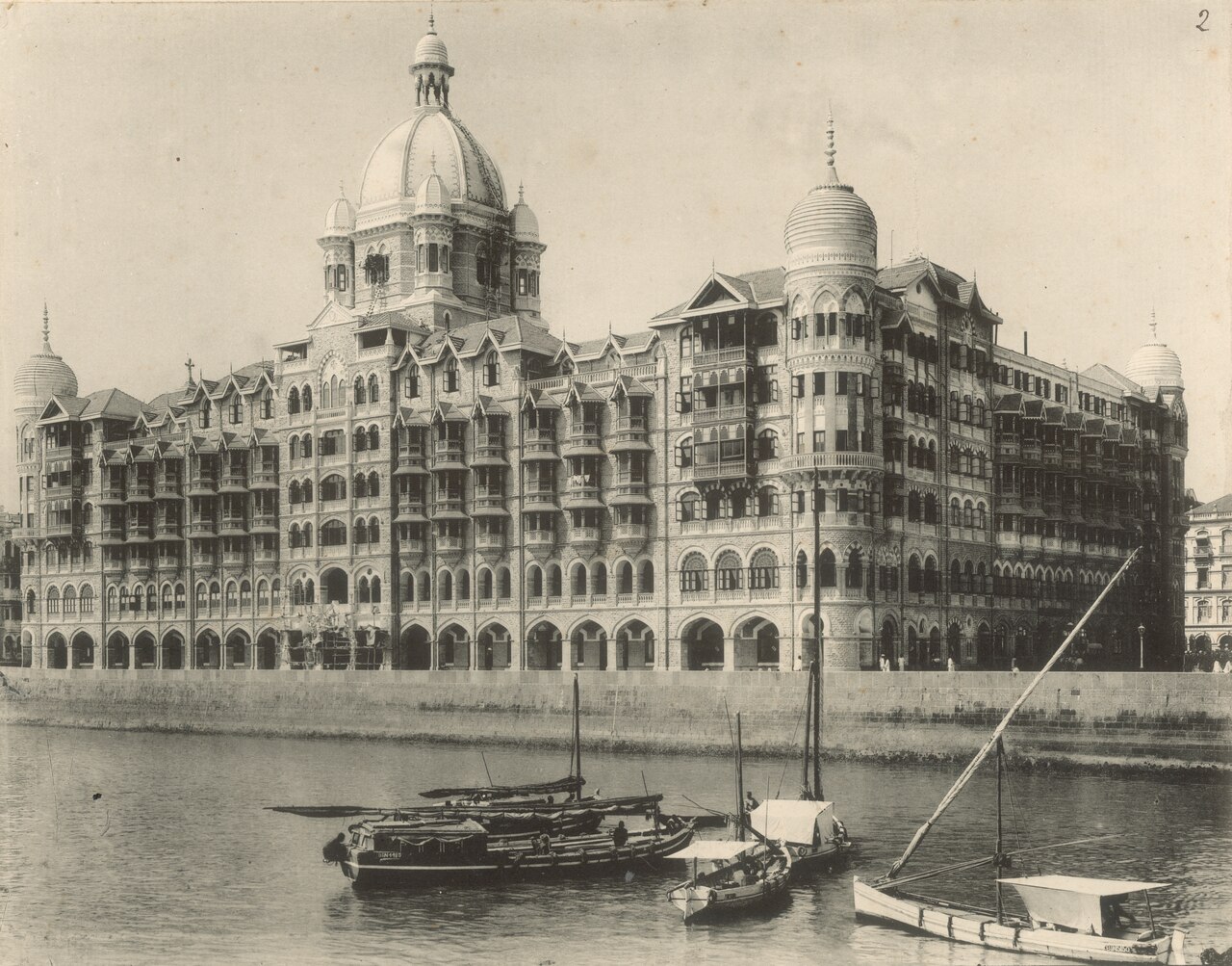 Taj Mahal Palace beside harbour boats around 1905, Mumbai, India.