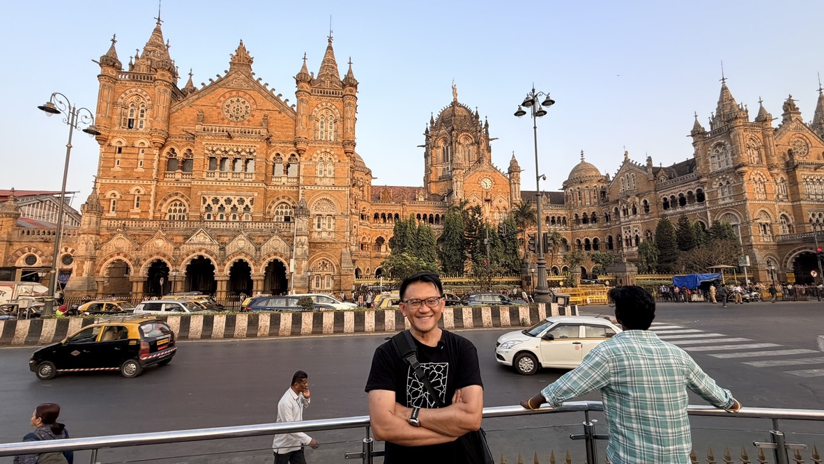 Traveller before Chhatrapati Shivaji Maharaj Terminus, Mumbai, India.
