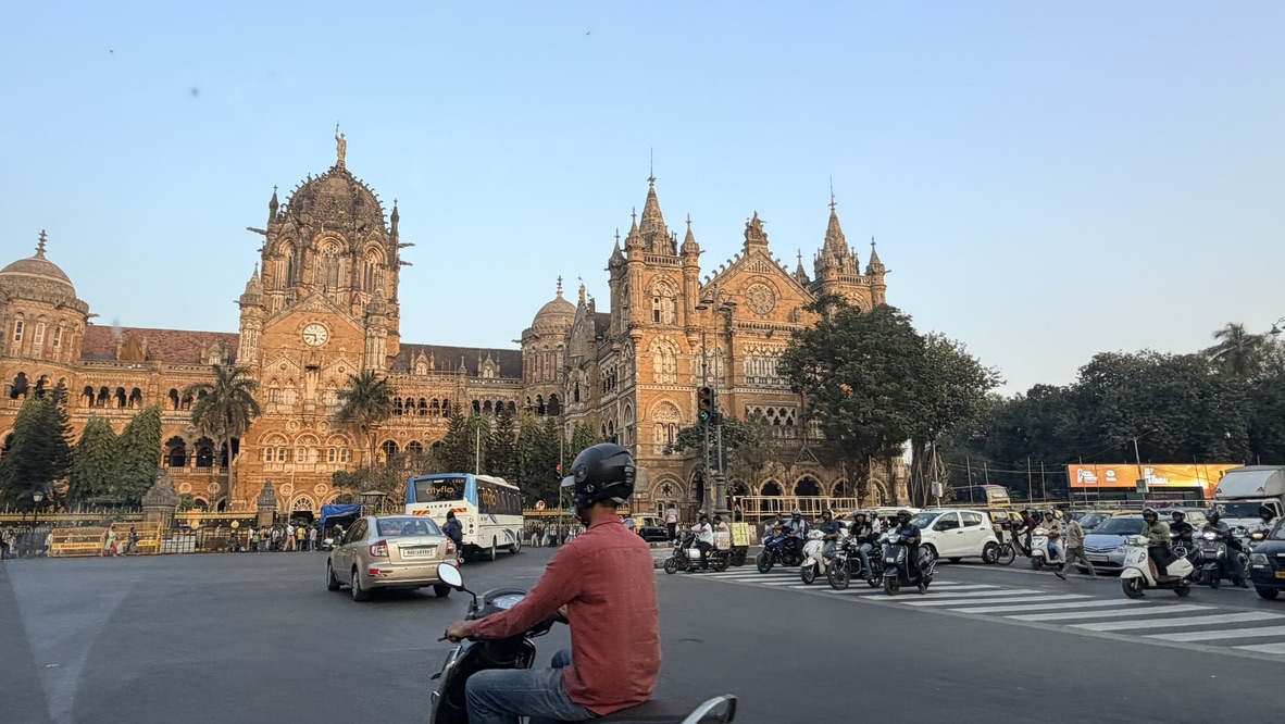 Traffic passing Chhatrapati Shivaji Maharaj Terminus, Mumbai, India.