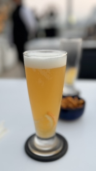 Glass of wheat beer at Dome rooftop bar, Mumbai, India.