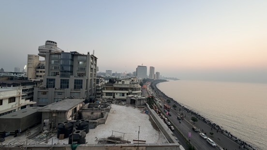 Marine Drive curving beside Back Bay at dusk, Mumbai, India.
