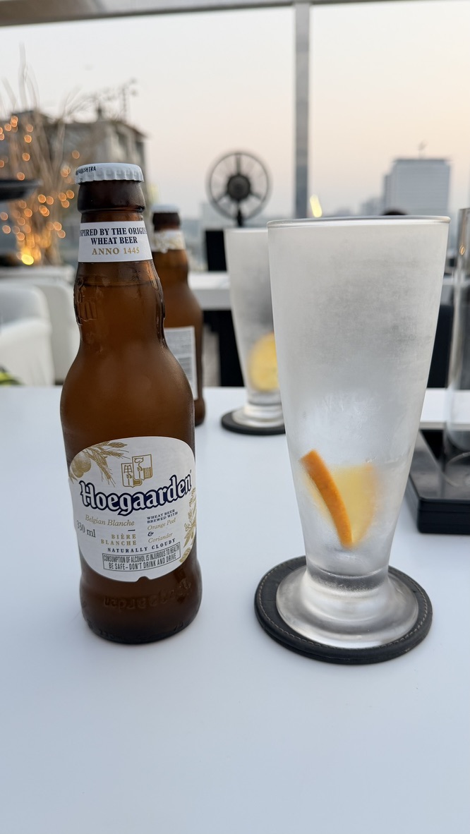 Hoegaarden beer and chilled glass at Dome rooftop bar, Mumbai, India.