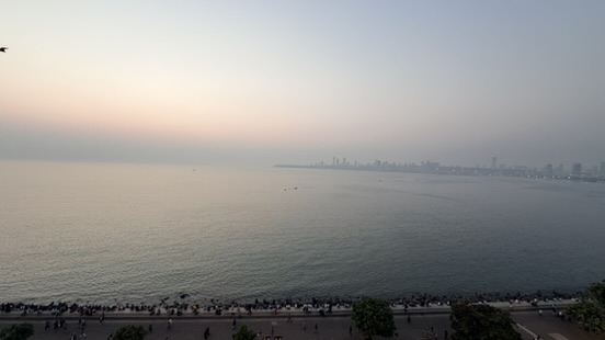 Back Bay and the Mumbai skyline seen from a rooftop at dusk, Mumbai, India.