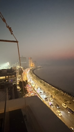 Marine Drive traffic and the Queen's Necklace illuminated at night, Mumbai, India.