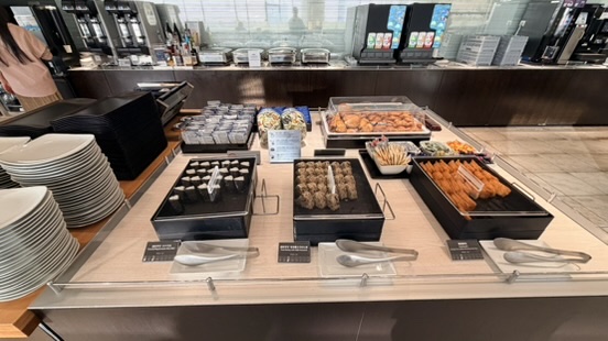 Japanese snacks and refreshments in an airport lounge at Tokyo Haneda Airport.