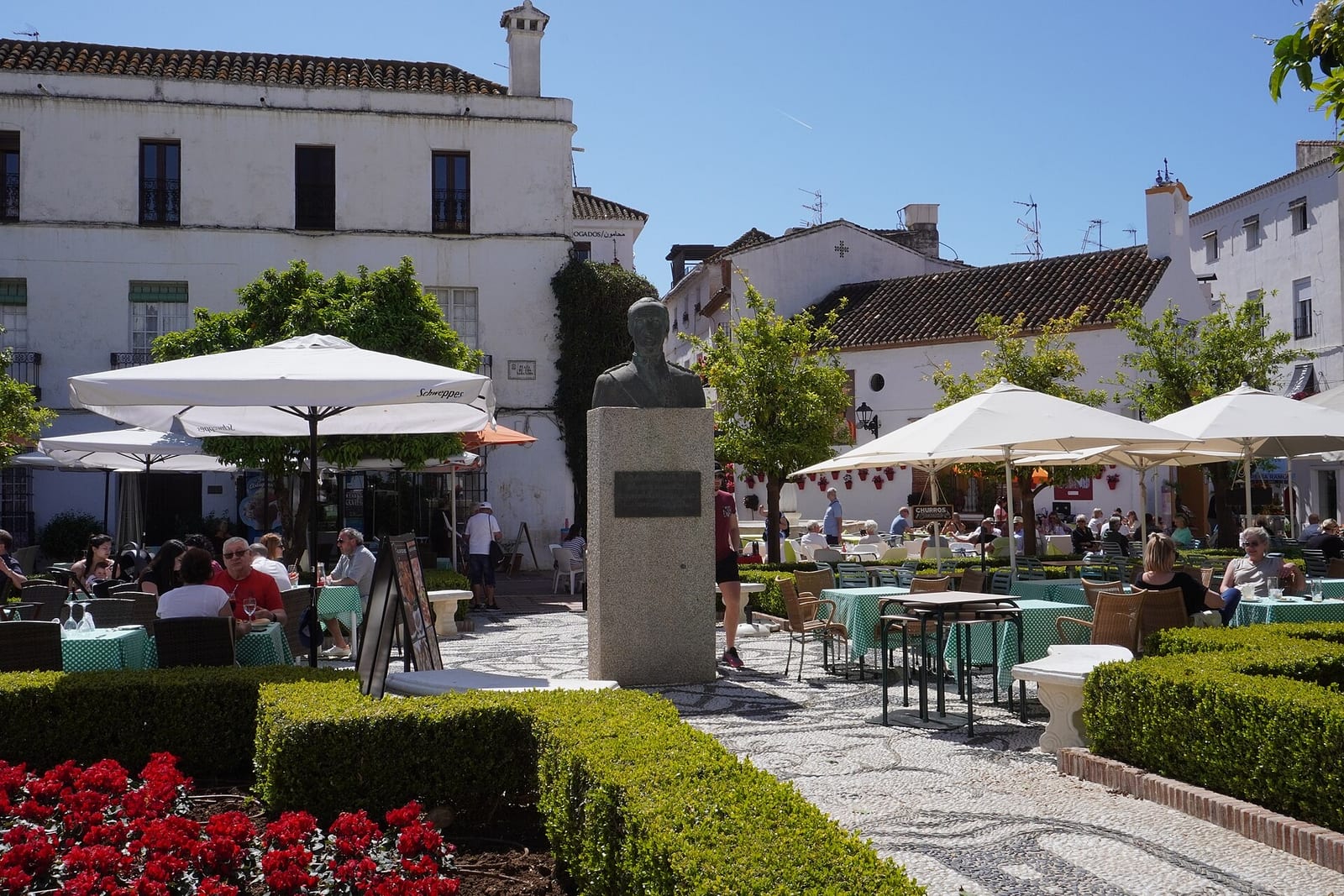 Orange Square in Marbella’s historic old town, framed by white façades and café tables