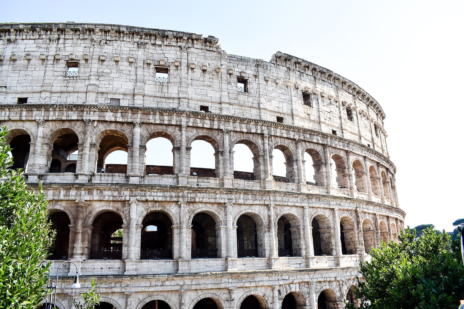 The Colosseum in Rome under a clear sky