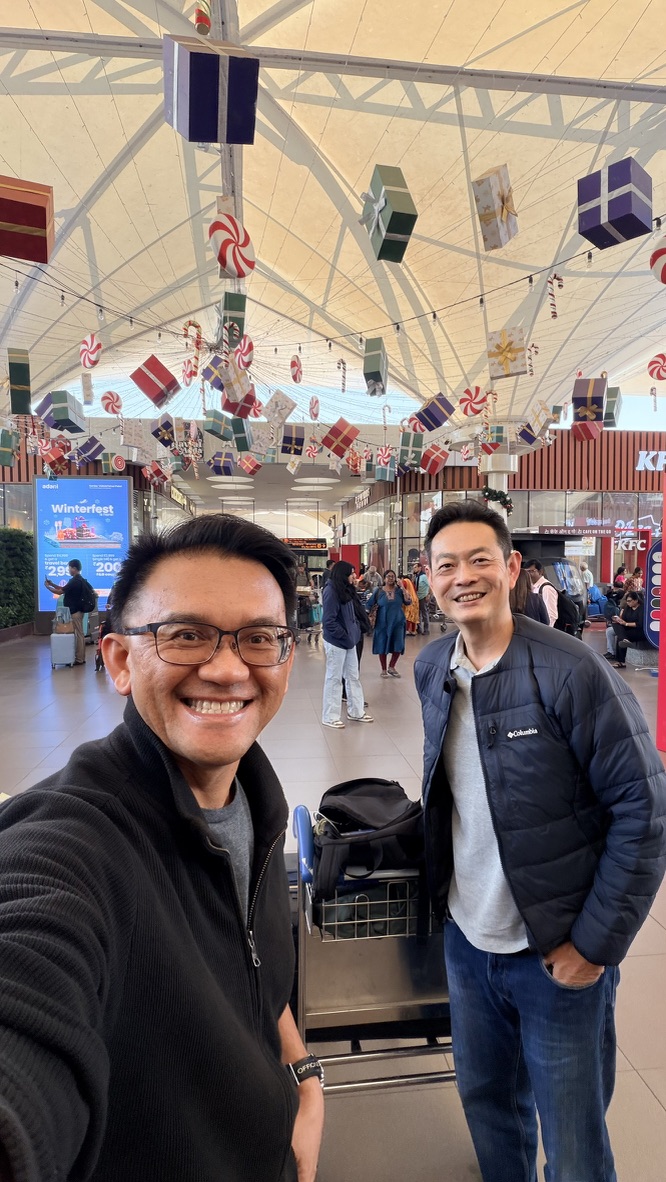 TOON and his travel companion with their luggage at the airport before arriving in Ahmedabad