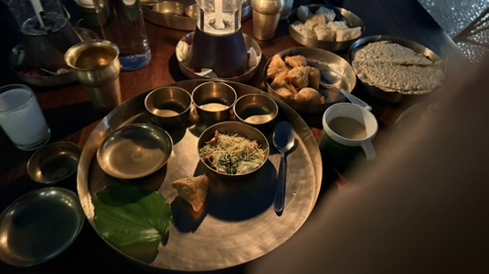 A traditional Gujarati thali served in bronze dishes at Agashiye in Ahmedabad