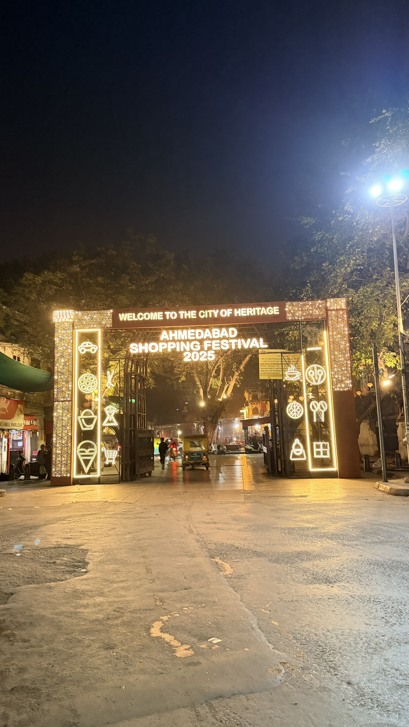 Illuminated Ahmedabad Shopping Festival entrance in the historic city at night