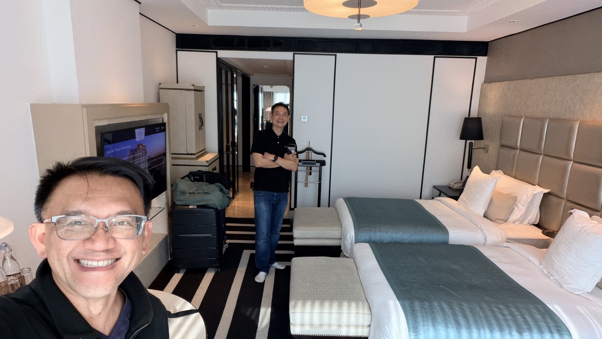 TOON and his travel companion inside a twin-bed guest room at ITC Narmada Ahmedabad