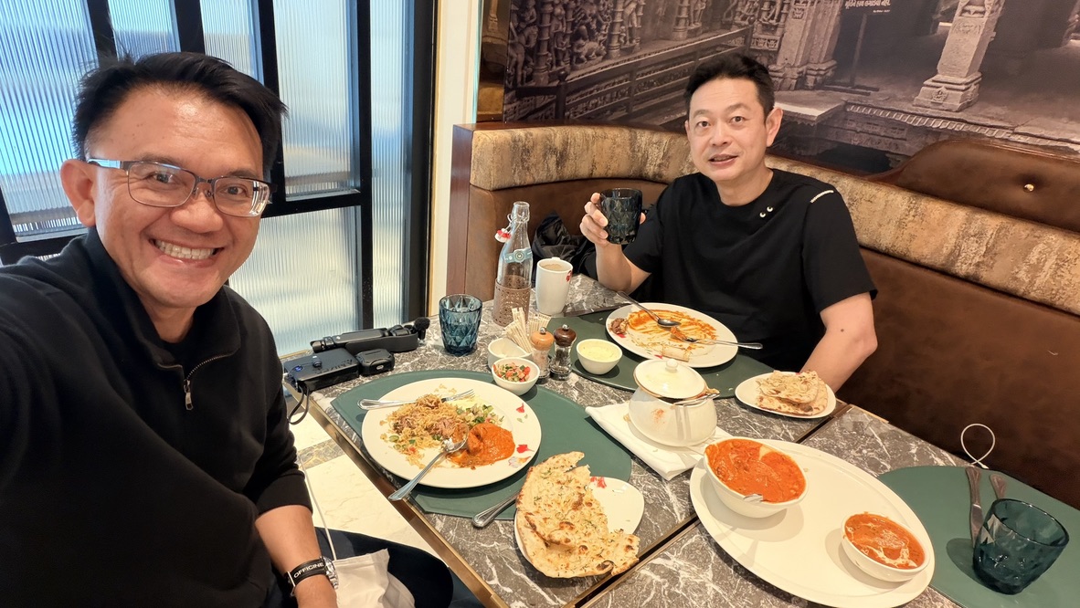 TOON and his travel companion having lunch with butter chicken, rice, and Indian breads at ITC Narmada