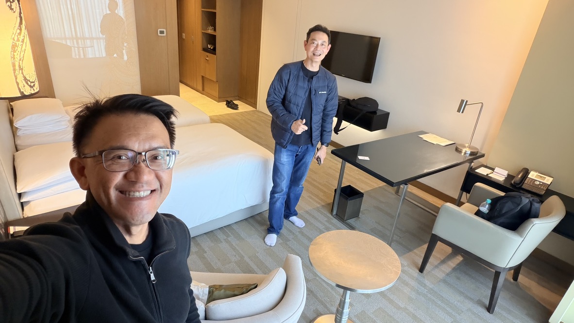 TOON and his travel companion inside a twin-bed room at Hyatt Regency Ahmedabad