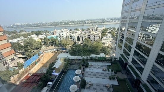 View from Hyatt Regency Ahmedabad over the hotel pool toward the Sabarmati River