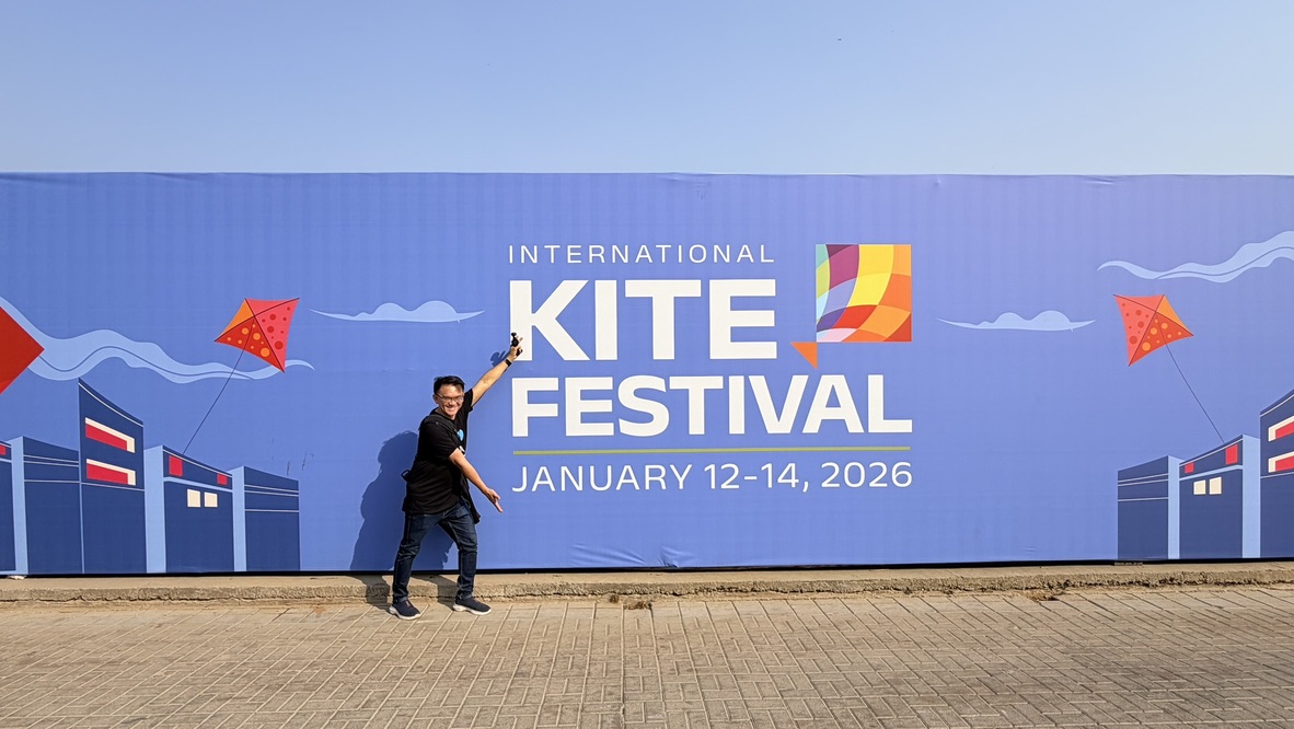 TOON beside International Kite Festival signage showing Ahmedabad dates January 12 to 14, 2026