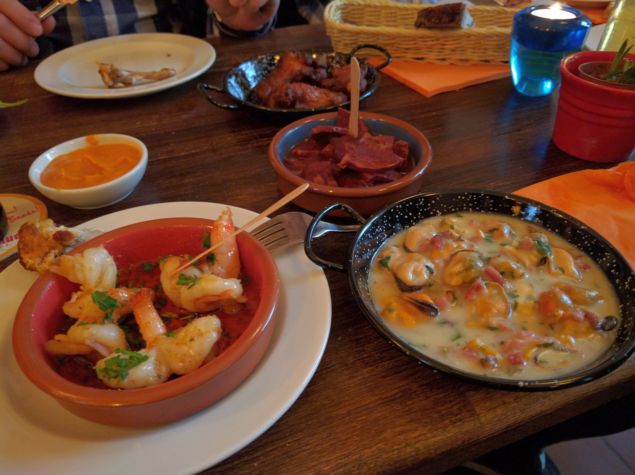 A table filled with assorted Spanish tapas and small plates