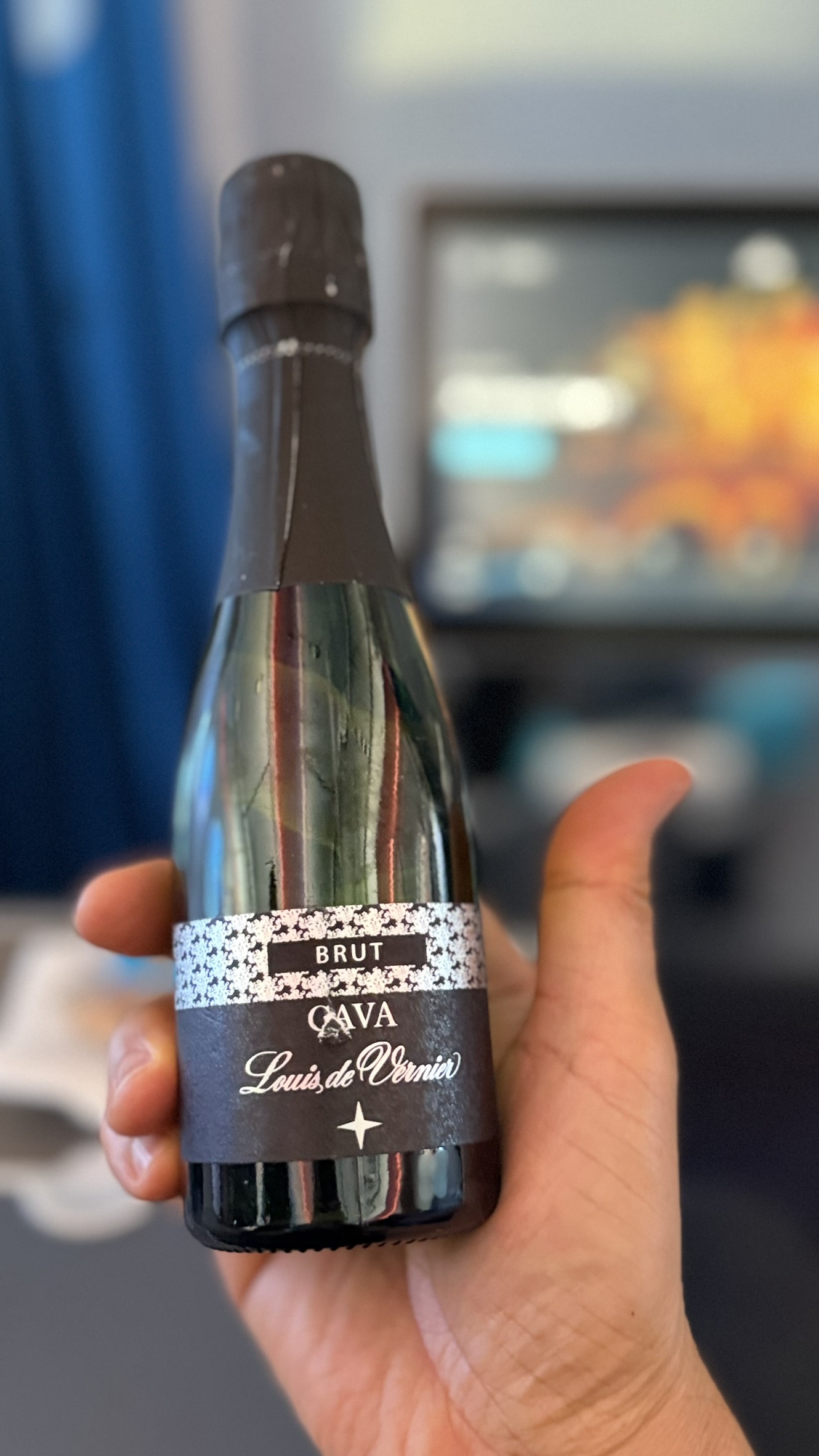 A miniature bottle of Cava served aboard KLM