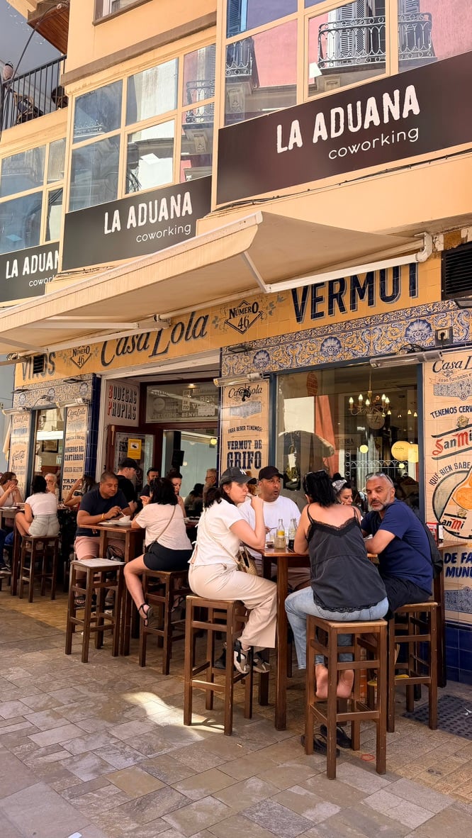 Diners gathered at high tables outside Casa Lola