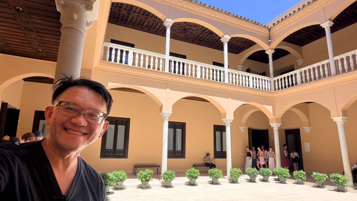 TOON standing in the sunlit courtyard of the Palacio de Buenavista