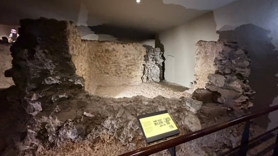 Excavated stone walls along the museum archaeology route