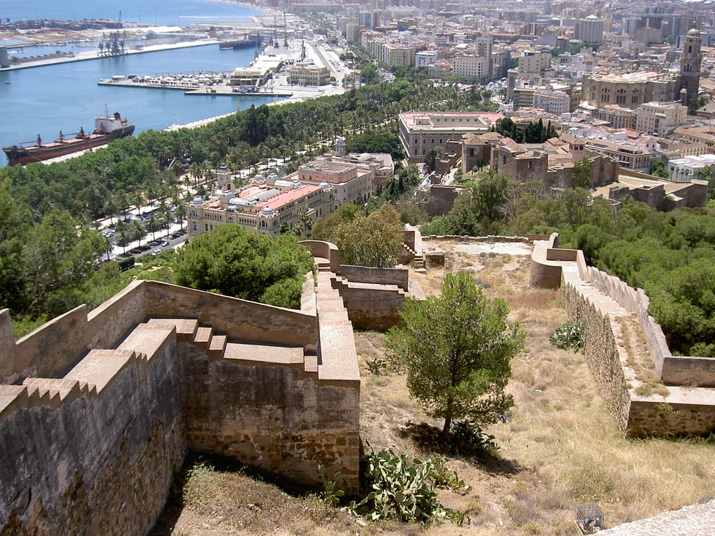 A wide view across Málaga’s port, historic center, cathedral, and Alcazaba