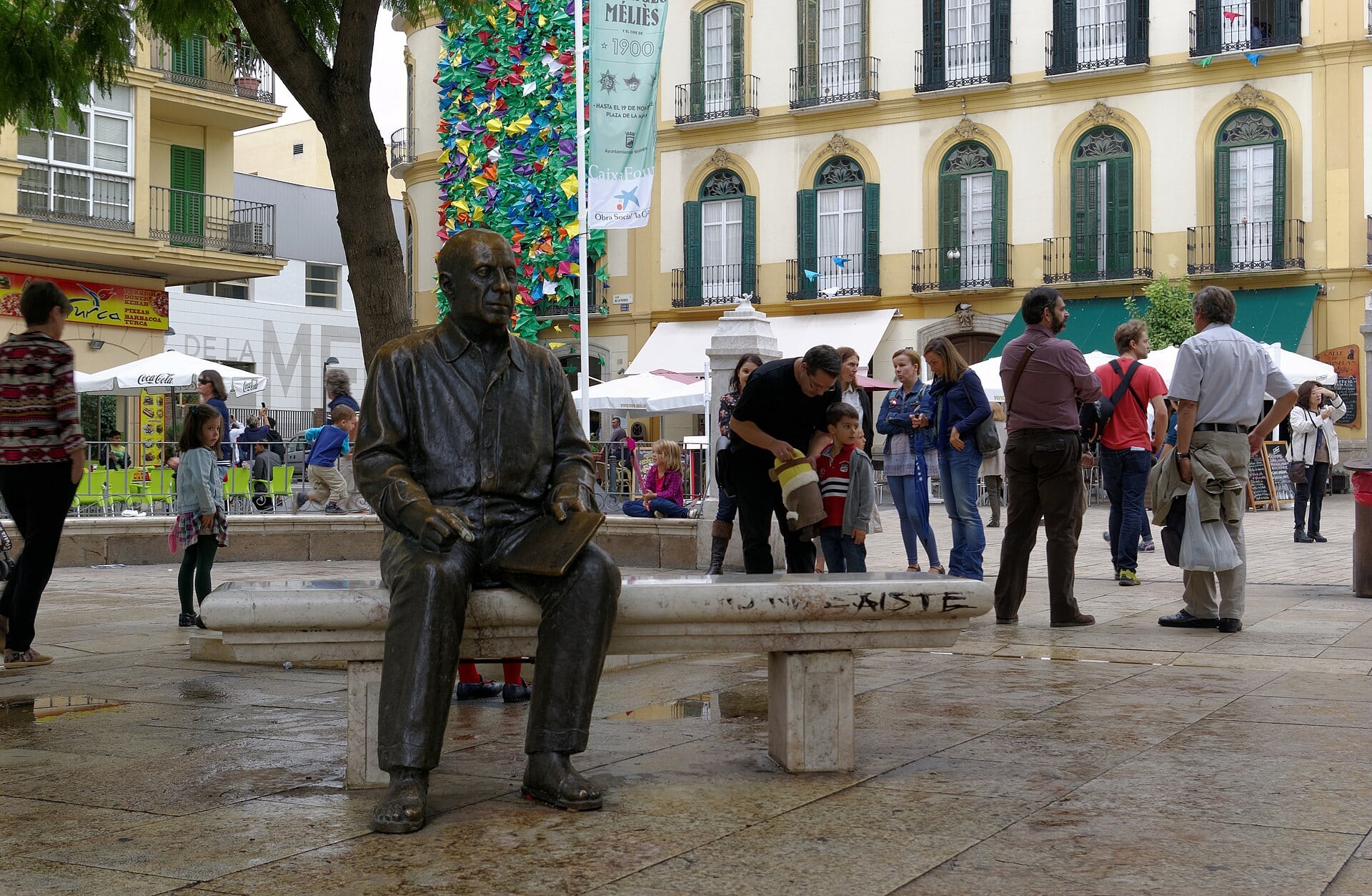 The seated bronze statue of Picasso in Plaza de la Merced